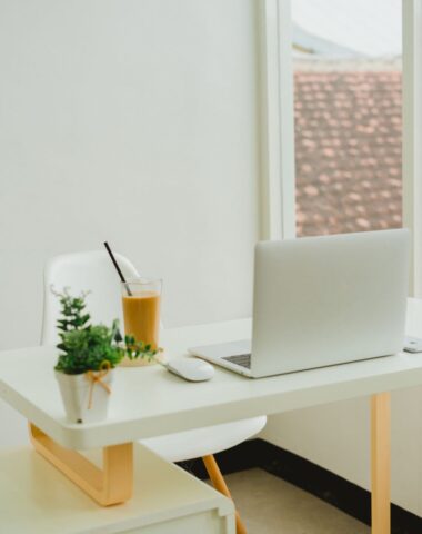 white chair at desk with laptop